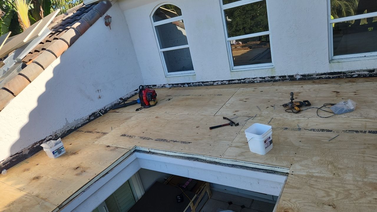 Tapered insulation being installed at the skylight roof area