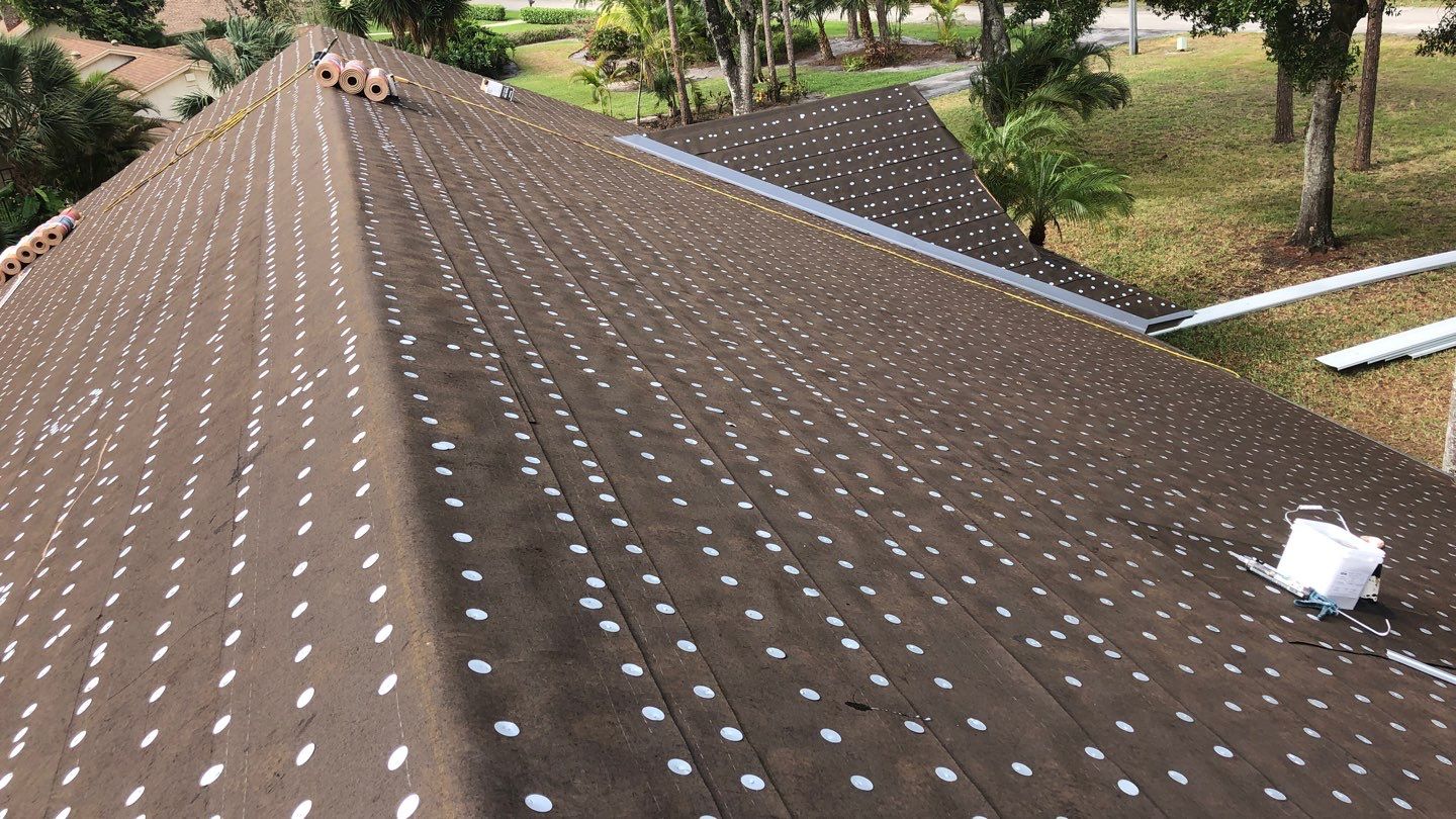 Fastened roof underlayment across the deck
