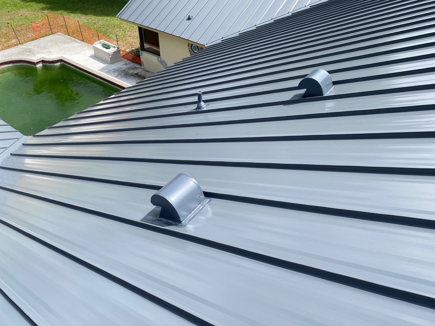Finished roof penetrations and standing seam panels