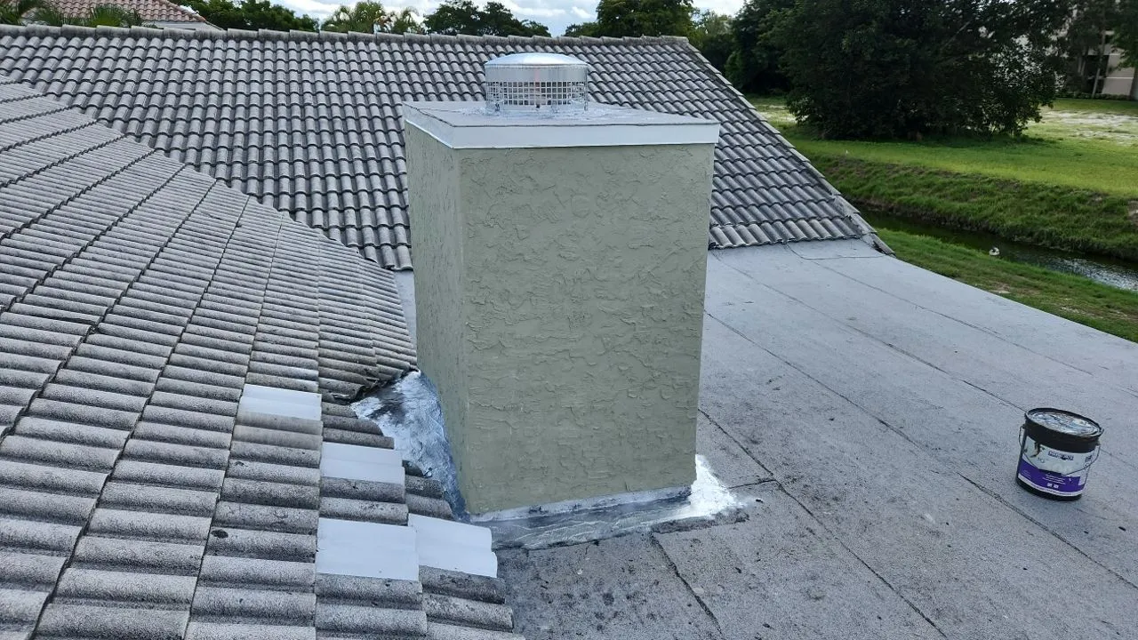 Tile and flat roof maintenance around a chimney in Boca Raton
