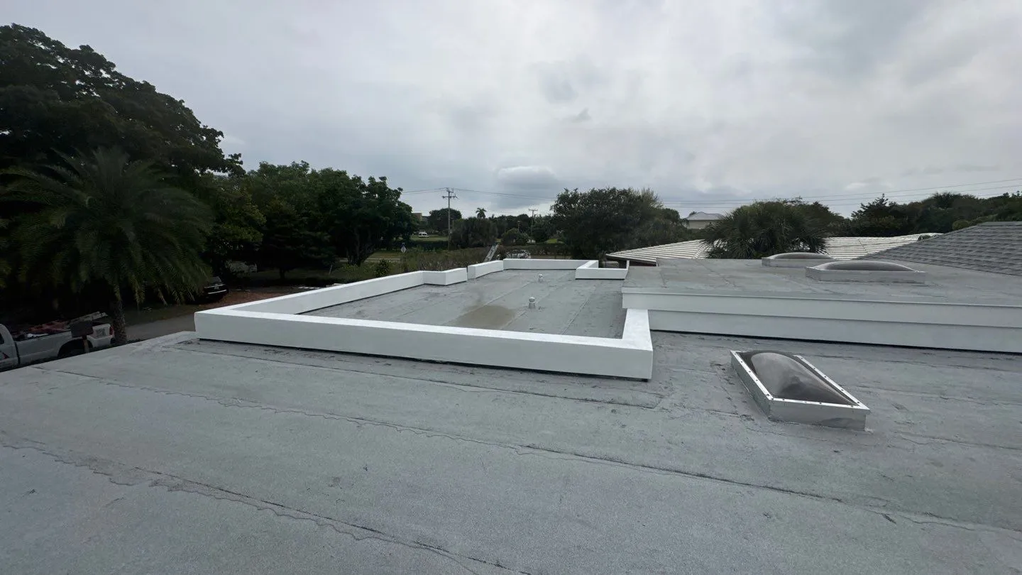 Flat roof with parapet walls and a skylight on a South Florida home