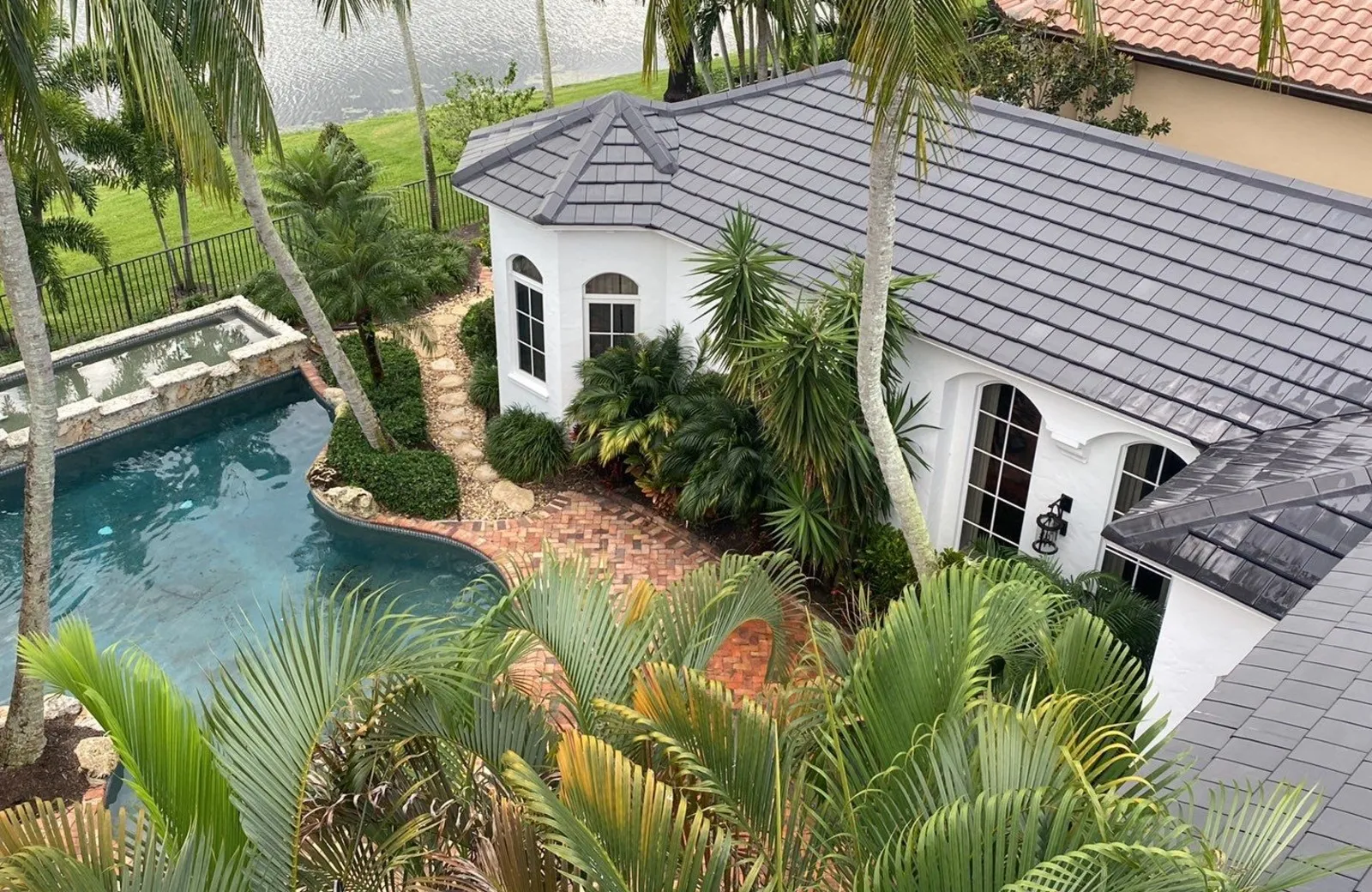 Gray concrete tile roof on a South Florida waterfront home