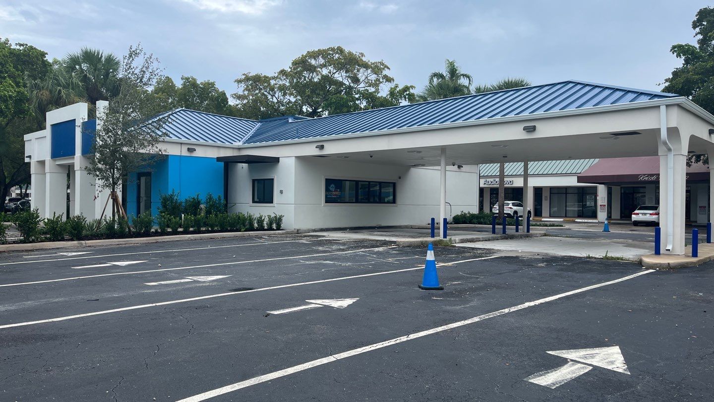 Completed blue standing-seam commercial roof in Delray Beach