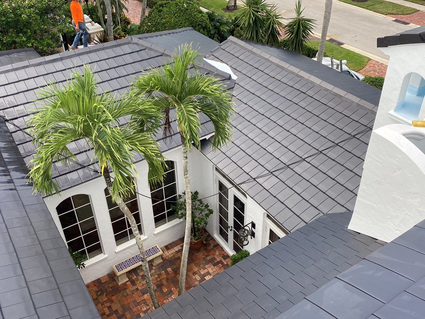 Completed clay tile roof surrounding the landscaped courtyard