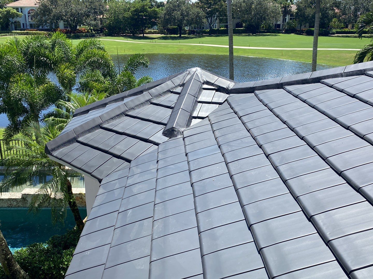 Finished clay tile roof showing hip and valley intersections in Delray Beach