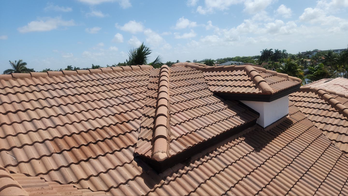 Completed tile roof after valley and rotted plywood repairs in Delray Beach