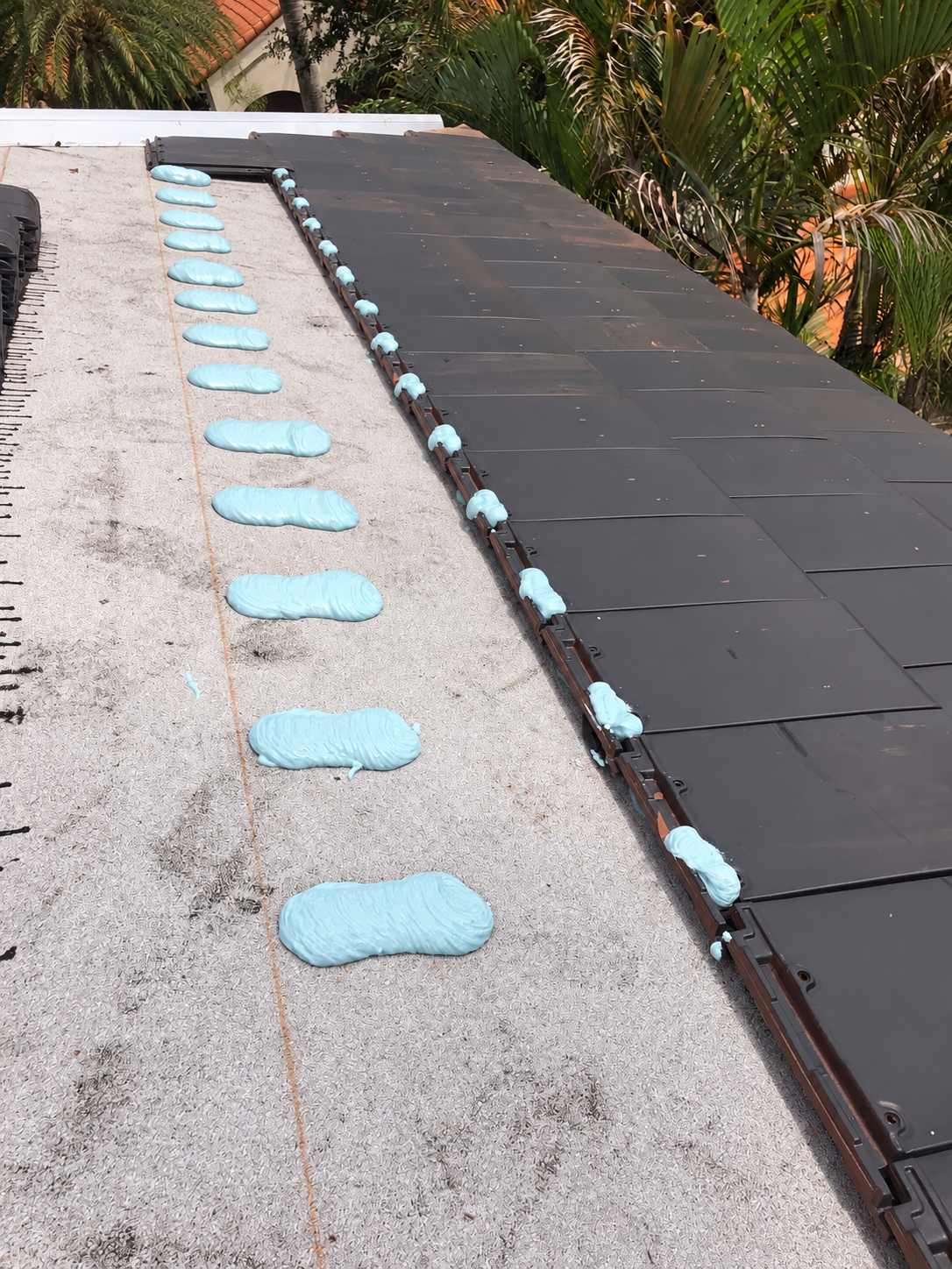 Adhesive placement during clay tile roof installation